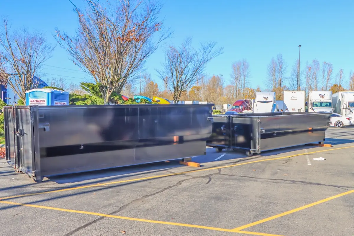Professional dumpster rental service with roll-off container on residential driveway in El Cerro Mission